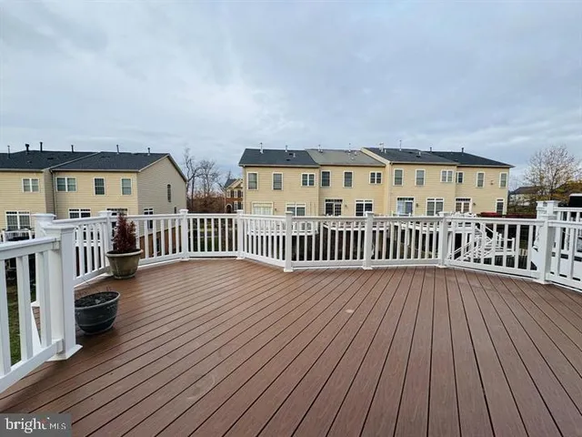 a view of a house with wooden deck
