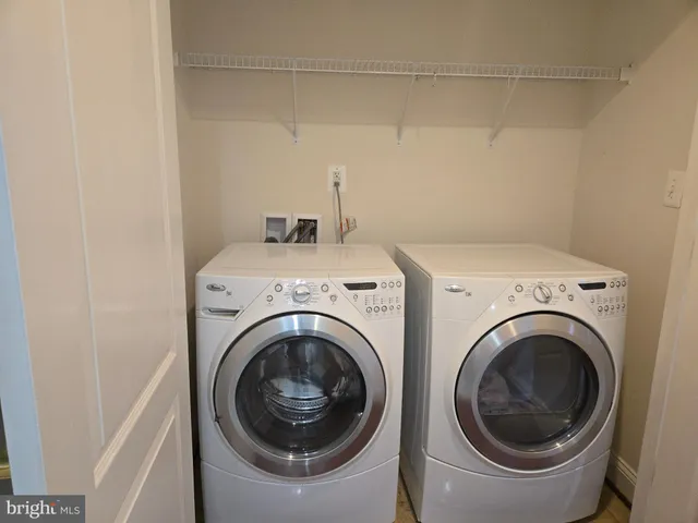 a view of a house with wooden deck and a yard
