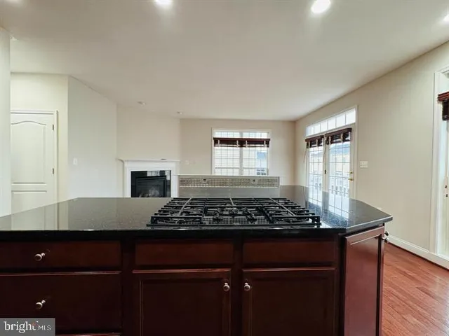 a view of kitchen island with wooden floor
