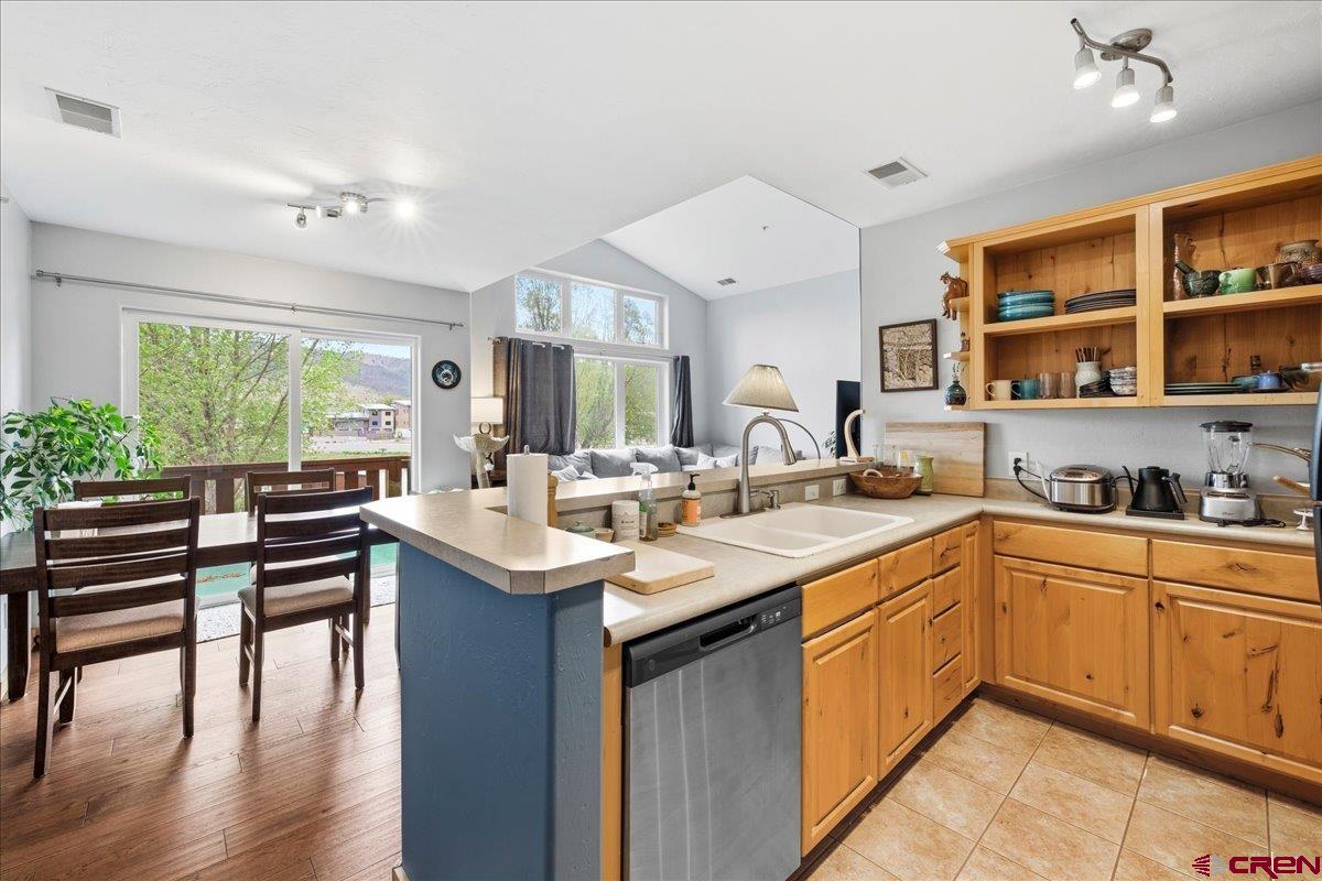 520 Redcliff Circle, Unit G203 Ridgway, CO 81432 - Photo 5 of 25 a kitchen with a sink stove and cabinets