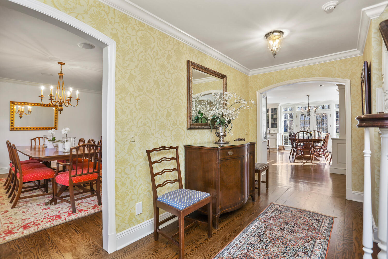 26 Beech Road New Canaan, CT 06840 - Photo 19 of 41 a living room with furniture and a chandelier
