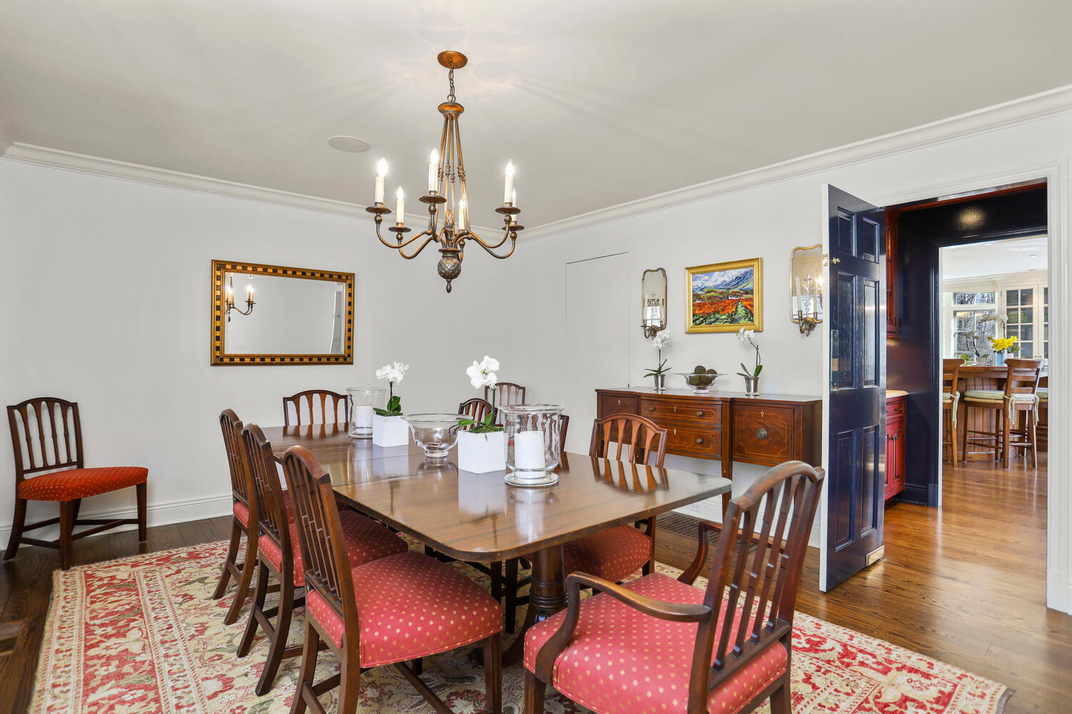 26 Beech Road New Canaan, CT 06840 - Photo 20 of 41 a view of a dining room with furniture wooden floor and chandelier