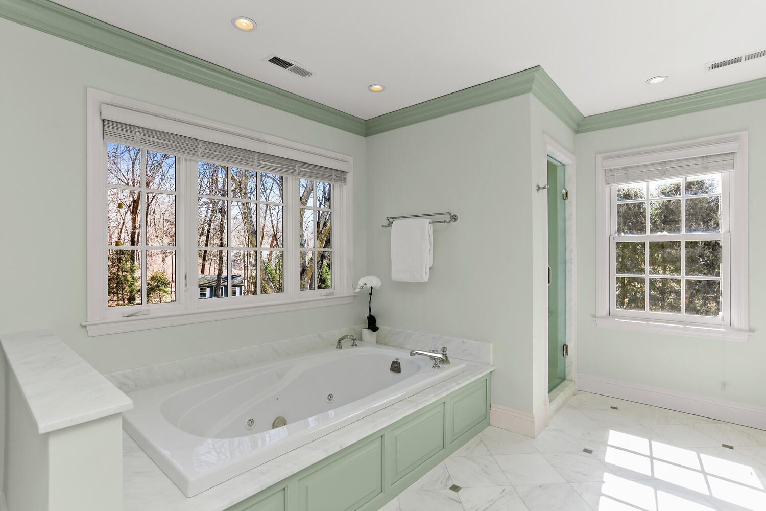 26 Beech Road New Canaan, CT 06840 - Photo 28 of 41 a bathroom with a bathtub and window