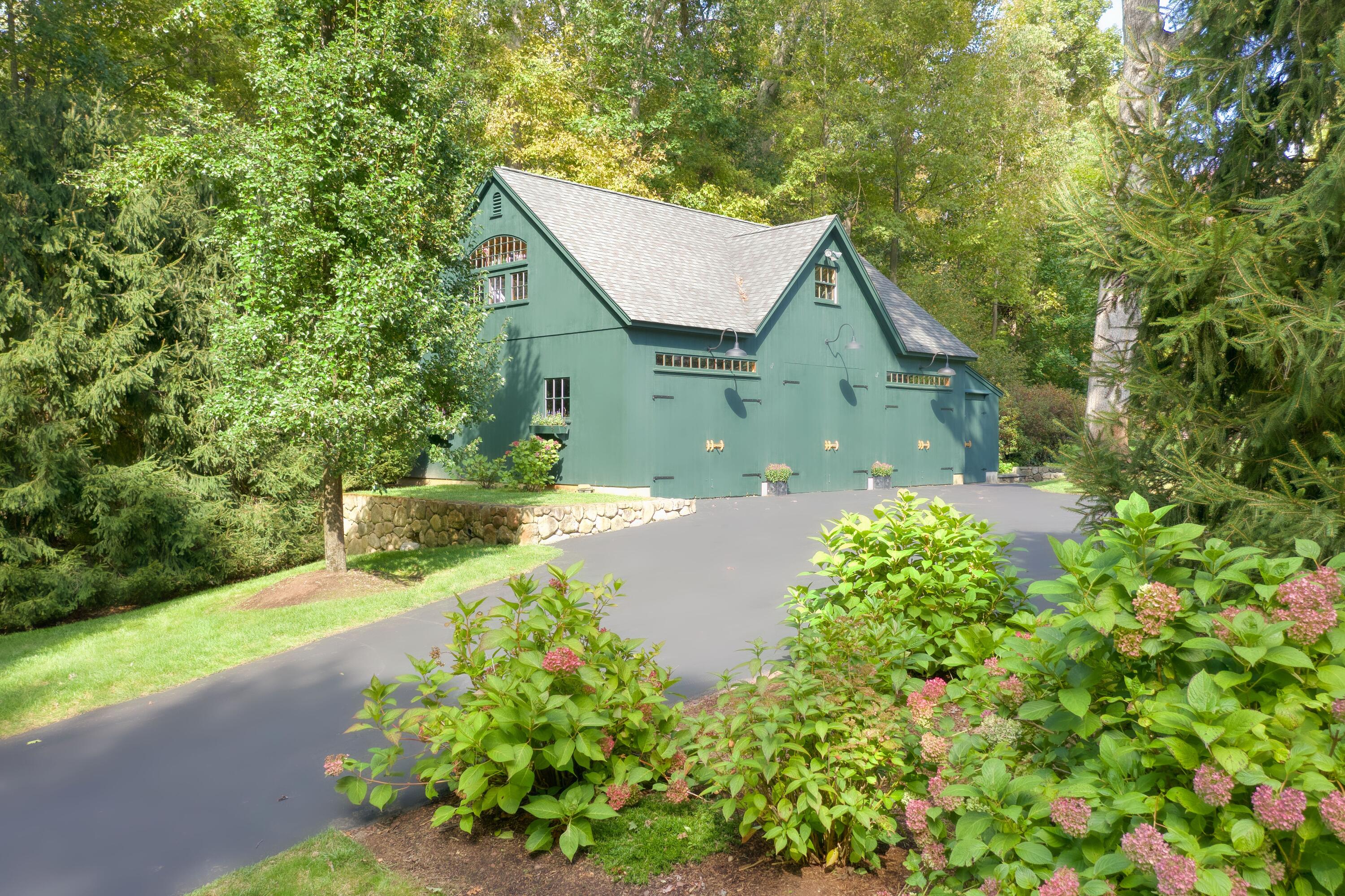 26 Beech Road New Canaan, CT 06840 - Photo 4 of 41 a front view of a house with garden