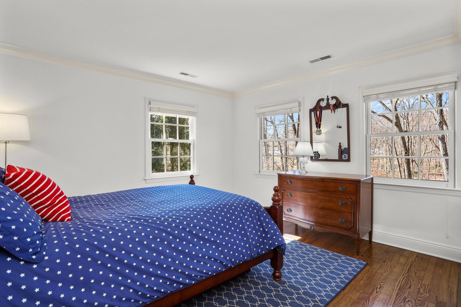 26 Beech Road New Canaan, CT 06840 - Photo 32 of 41 a bedroom with a bed and wooden floor