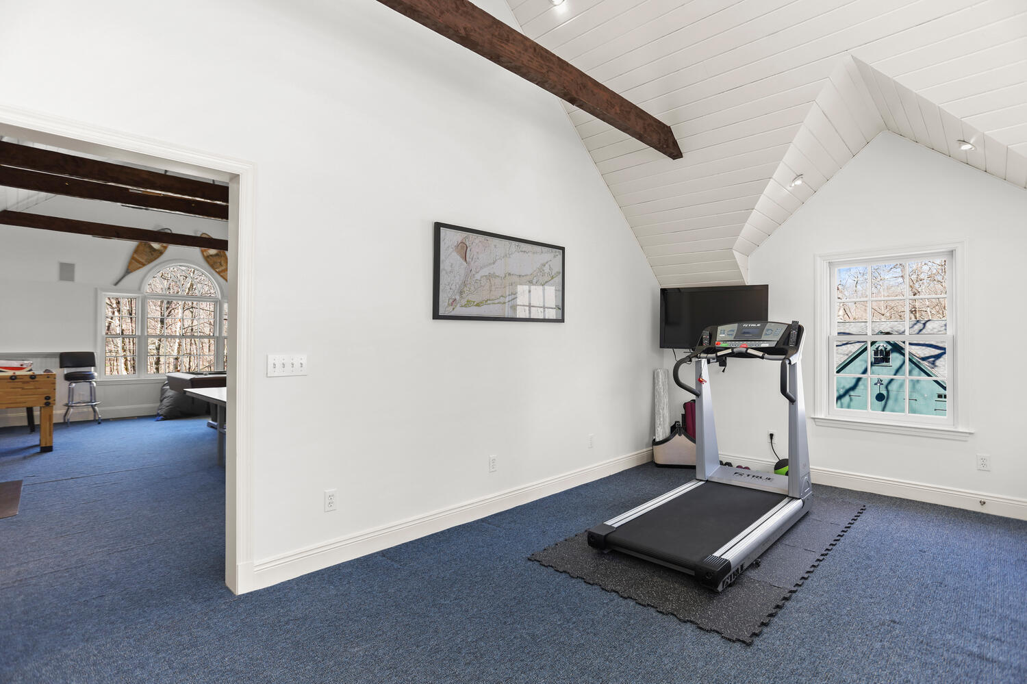26 Beech Road New Canaan, CT 06840 - Photo 36 of 41 a room with gym equipment and a window