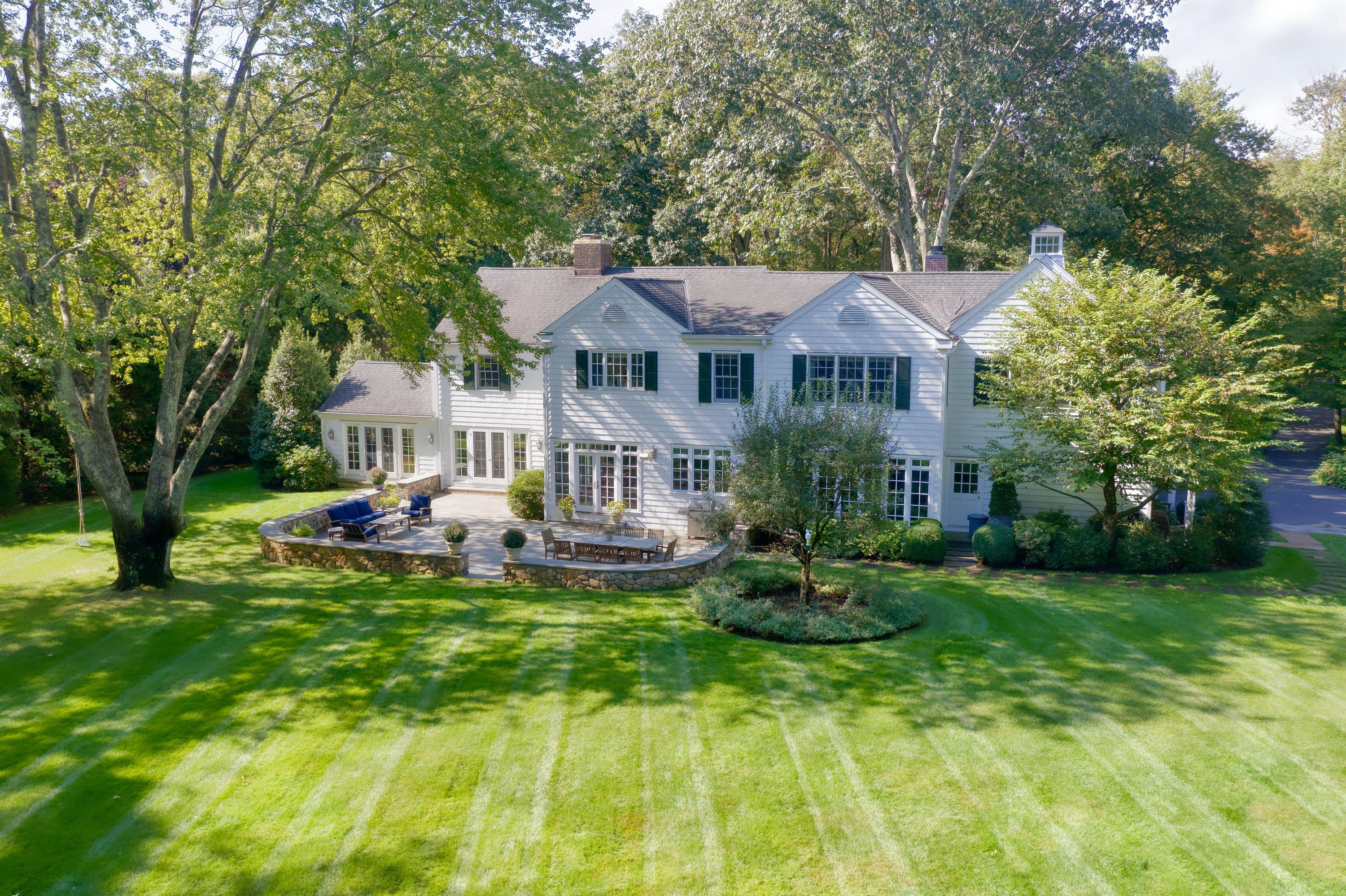 26 Beech Road New Canaan, CT 06840 - Photo 39 of 41 a front view of a house with garden