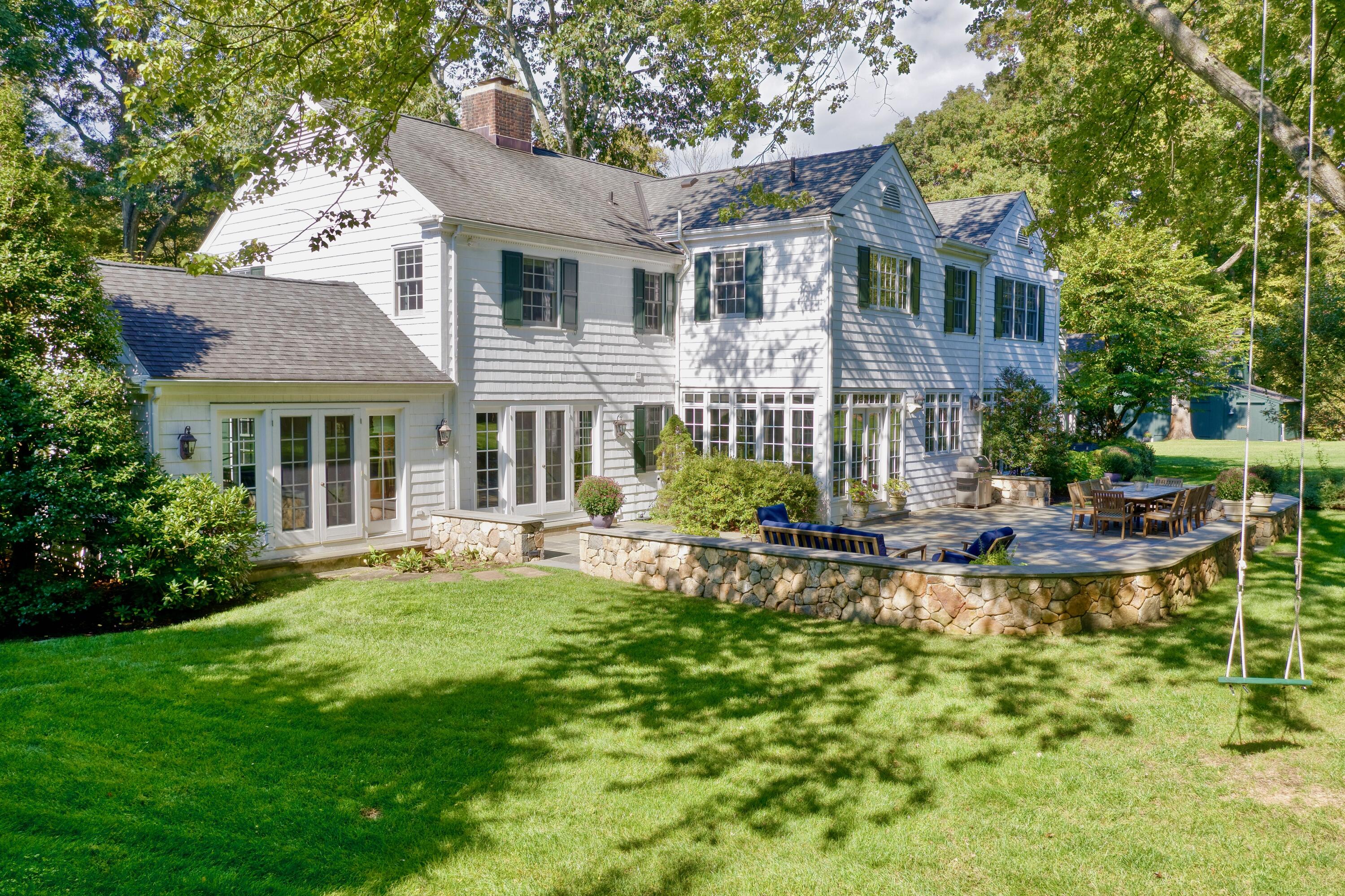 26 Beech Road New Canaan, CT 06840 - Photo 6 of 41 a view of a house with a yard and sitting area