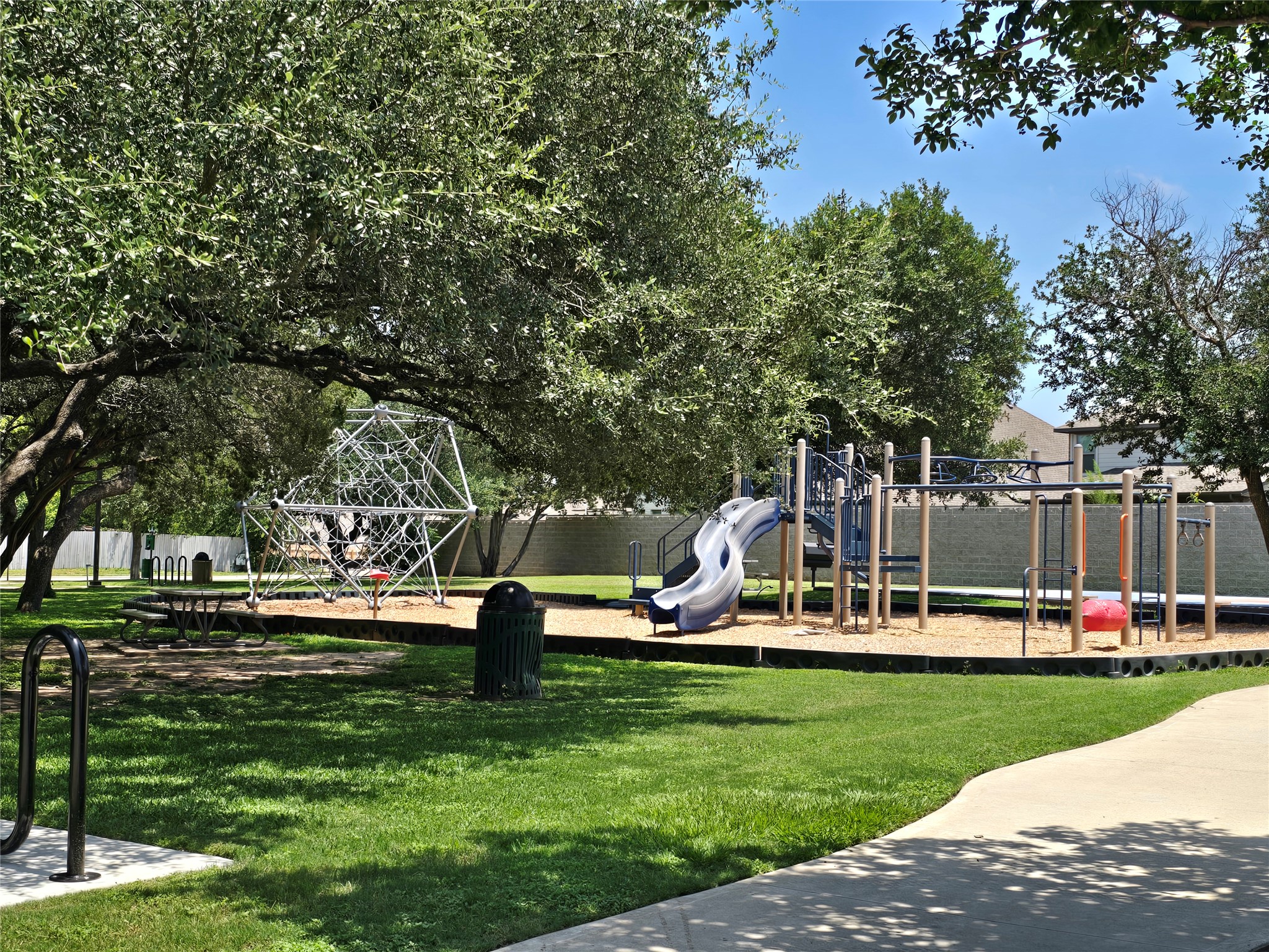 2021 Rim Rock Drive Leander, TX 78641 - Photo 10 of 14 A community playground, framed by shade trees, promises endless outdoor fun for all.