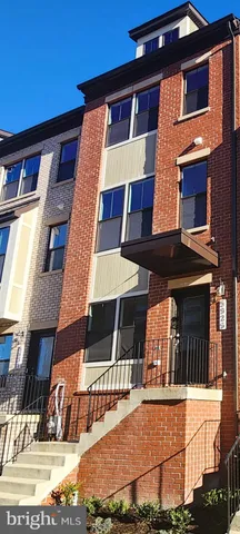 a view of multiple houses with a street