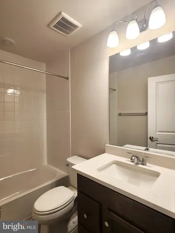 a bathroom with a bathtub a sink and a toilet