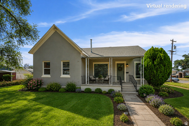 327 35th Street Ogden, UT 84401 - Photo 2 of 31 Stucco exterior featuring a covered porch with decorative railings, a front entry door with transom window, and a stone-paved walkway
