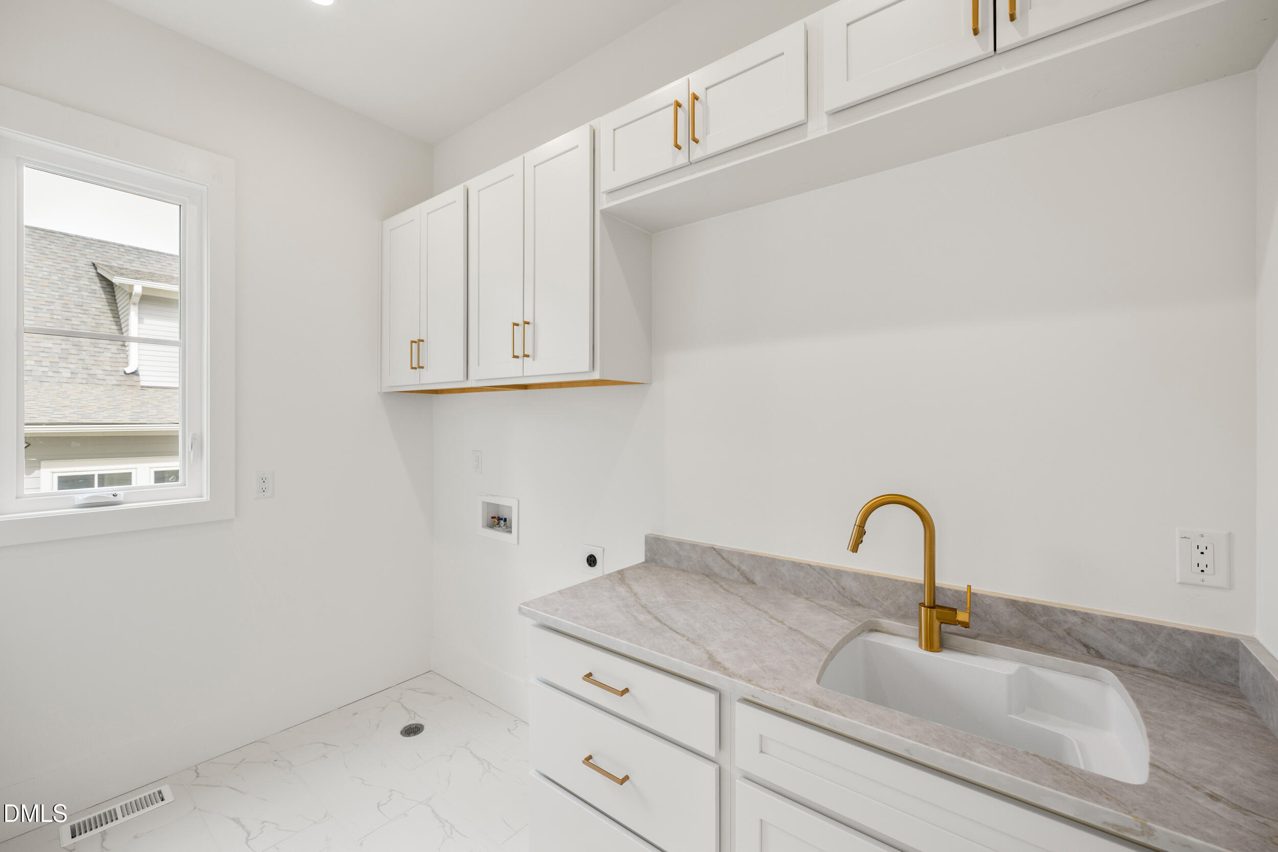 2817 Claremont Road Raleigh, NC 27608 - Photo 26 of 73 a close view of sink and tap
