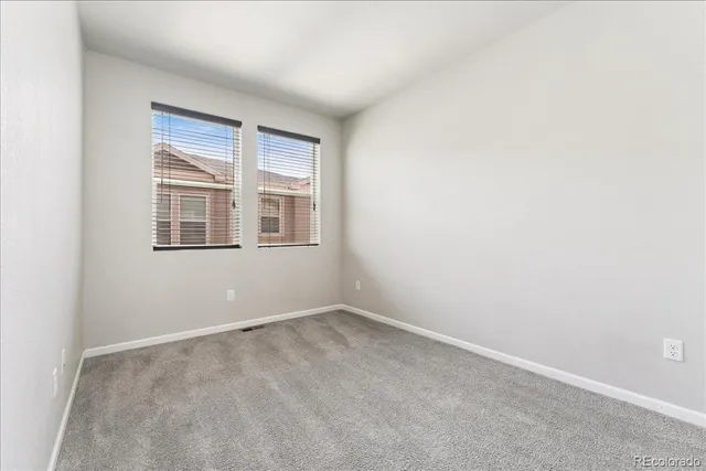 a view of empty room with windows
