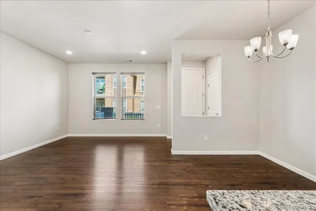 a view of a kitchen with a sink and a stove top oven