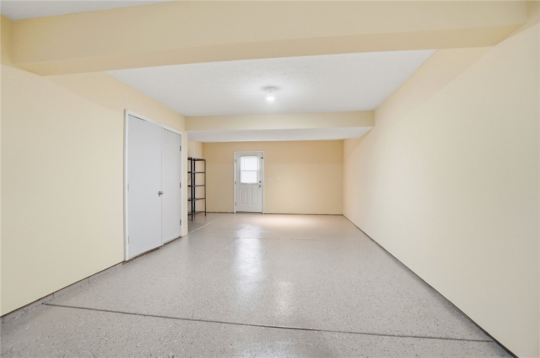 4324 Straight Arrow Road Dayton, OH 45430 - Photo 39 of 40 This spacious garage offers a clean, well-maintained space with ample room for storage and parking.