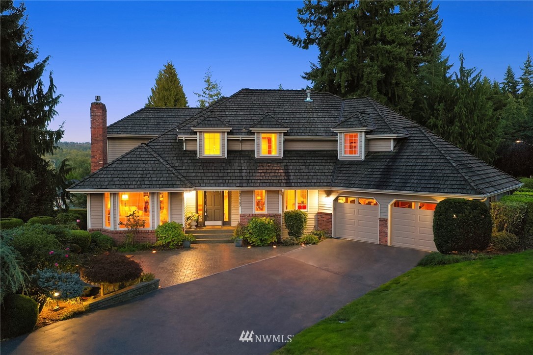 21127 47th Drive Southeast Bothell, WA 98021 - Photo 2 of 38 a front view of a house with a yard