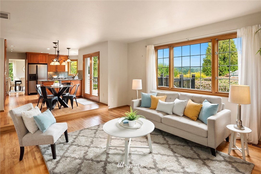 21127 47th Drive Southeast Bothell, WA 98021 - Photo 12 of 38 a living room with furniture and a large window