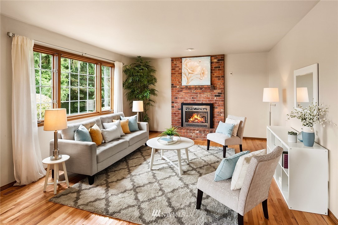 21127 47th Drive Southeast Bothell, WA 98021 - Photo 13 of 38 a living room with fireplace furniture and a large window