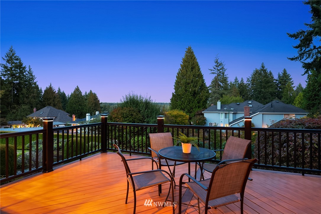 21127 47th Drive Southeast Bothell, WA 98021 - Photo 16 of 38 a balcony with wooden floor table and chairs