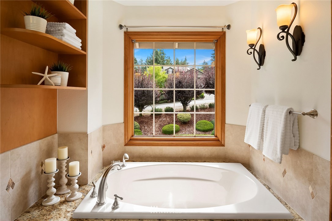 21127 47th Drive Southeast Bothell, WA 98021 - Photo 20 of 38 a bath tub sitting next to a window