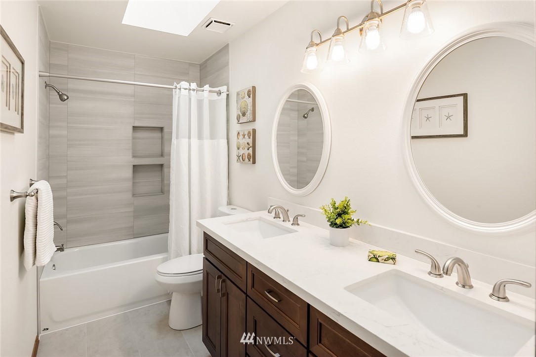 21127 47th Drive Southeast Bothell, WA 98021 - Photo 23 of 38 a bathroom with a sink mirror toilet and bathtub
