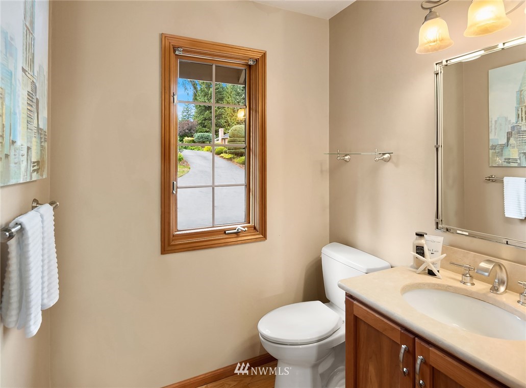 21127 47th Drive Southeast Bothell, WA 98021 - Photo 26 of 38 a bathroom with a sink toilet and mirror
