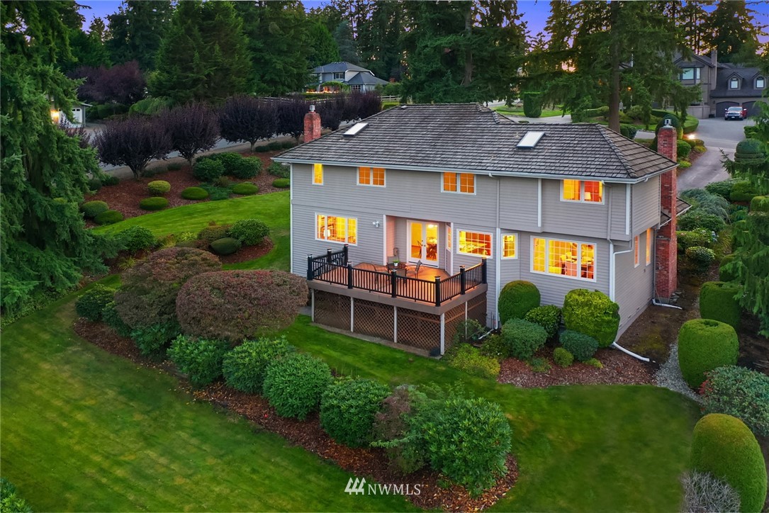 21127 47th Drive Southeast Bothell, WA 98021 - Photo 29 of 38 a aerial view of a house with table and chairs and a swimming pool
