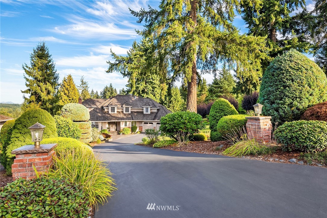 21127 47th Drive Southeast Bothell, WA 98021 - Photo 37 of 38 a front view of a house with a yard and fountain