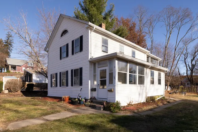 a view of a white house with a large windows