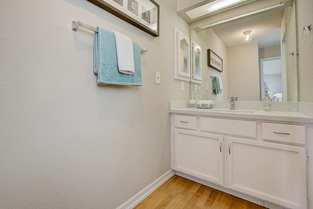 1303 Victoria Terrace Sunnyvale, CA 94087 - Photo 19 of 27 a bathroom with a sink and a mirror