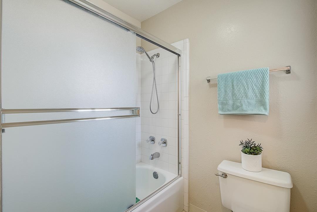 1303 Victoria Terrace Sunnyvale, CA 94087 - Photo 20 of 27 a bathroom with a shower a toilet and a shower