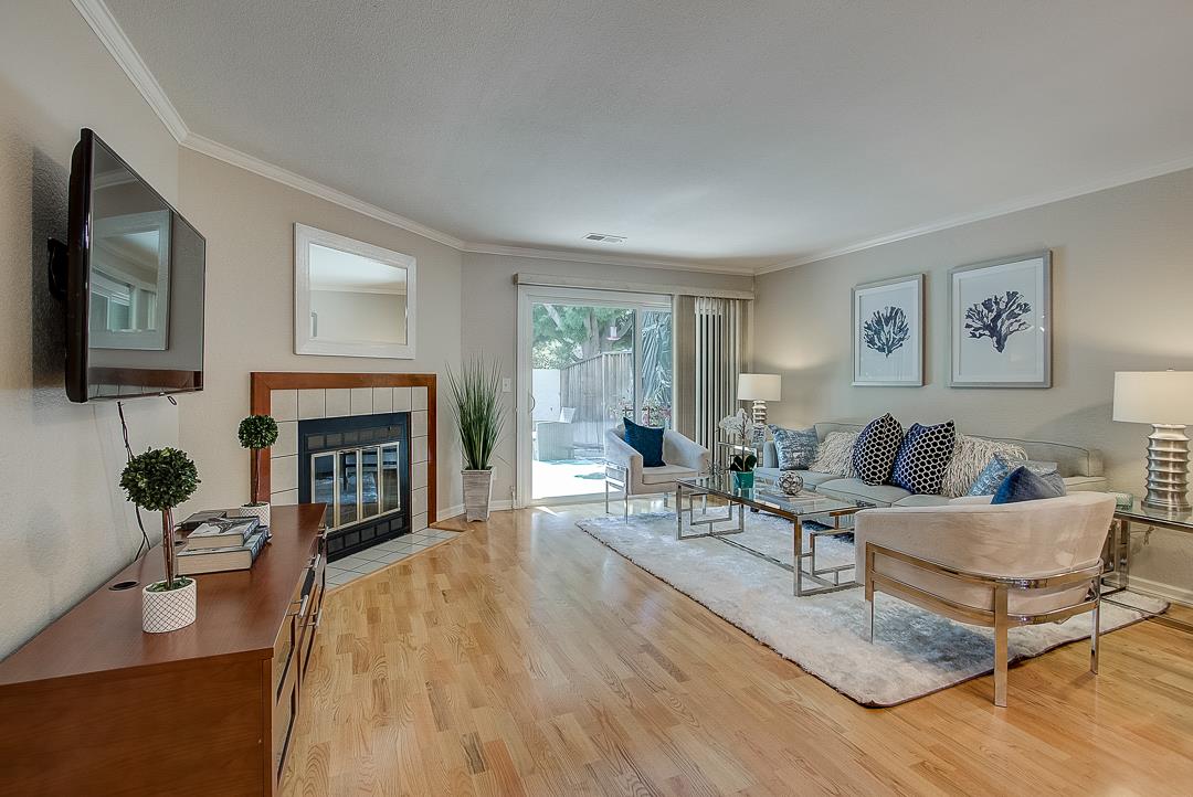1303 Victoria Terrace Sunnyvale, CA 94087 - Photo 2 of 27 a living room with furniture and a fireplace