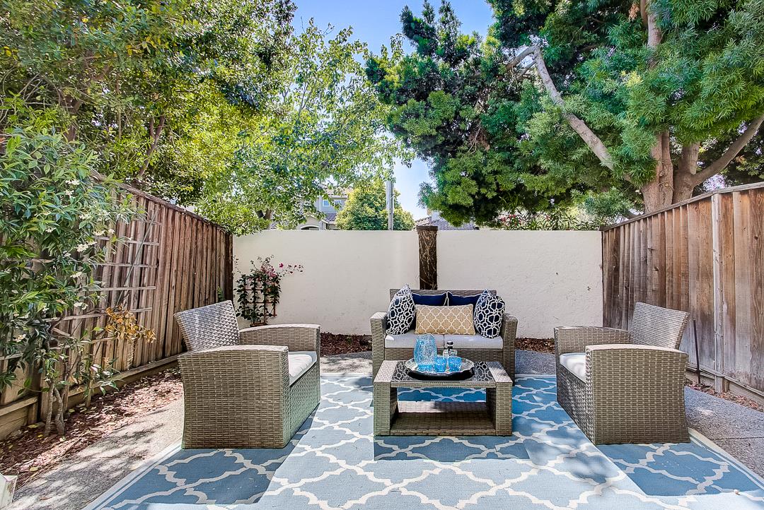 1303 Victoria Terrace Sunnyvale, CA 94087 - Photo 21 of 27 a view of a patio with couches potted plants and large tree