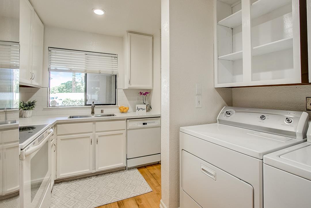 1303 Victoria Terrace Sunnyvale, CA 94087 - Photo 8 of 27 a utility room with cabinets washer and dryer