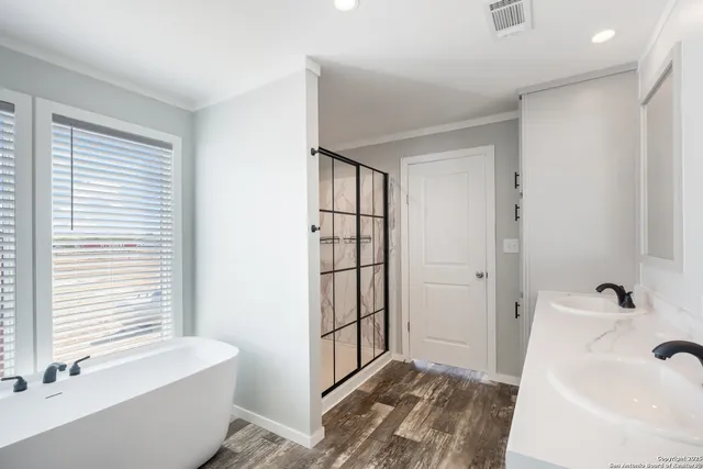 a bathroom with a bathtub and a sink