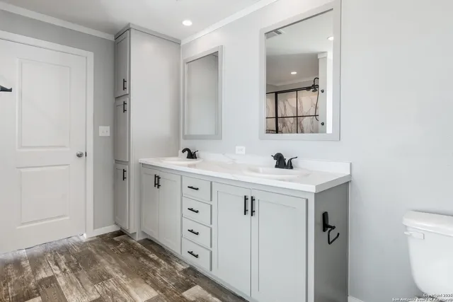 a bathroom with a sink vanity and mirror