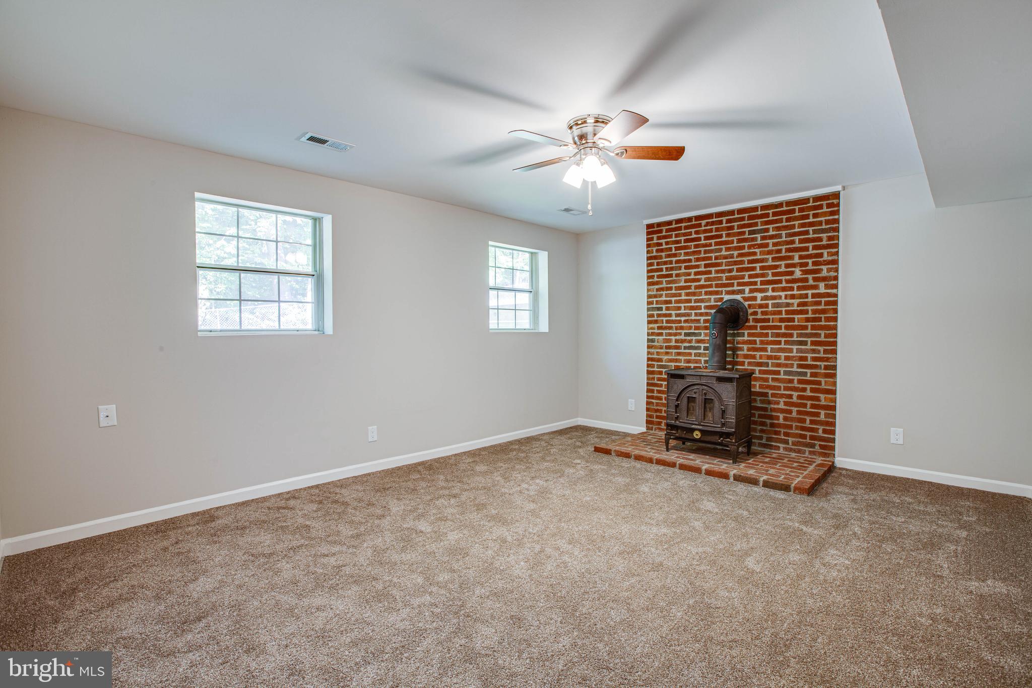 741 Courthouse Road Stafford, VA 22554 - Photo 17 of 29 Lower Family Room with Wood Stove