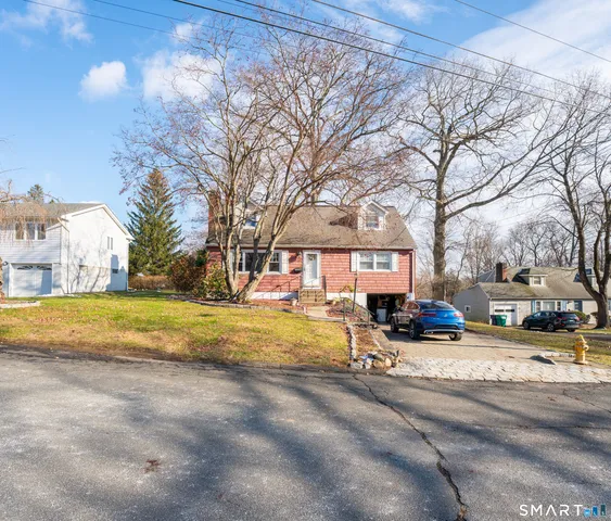 a view of a yard with a house in the background
