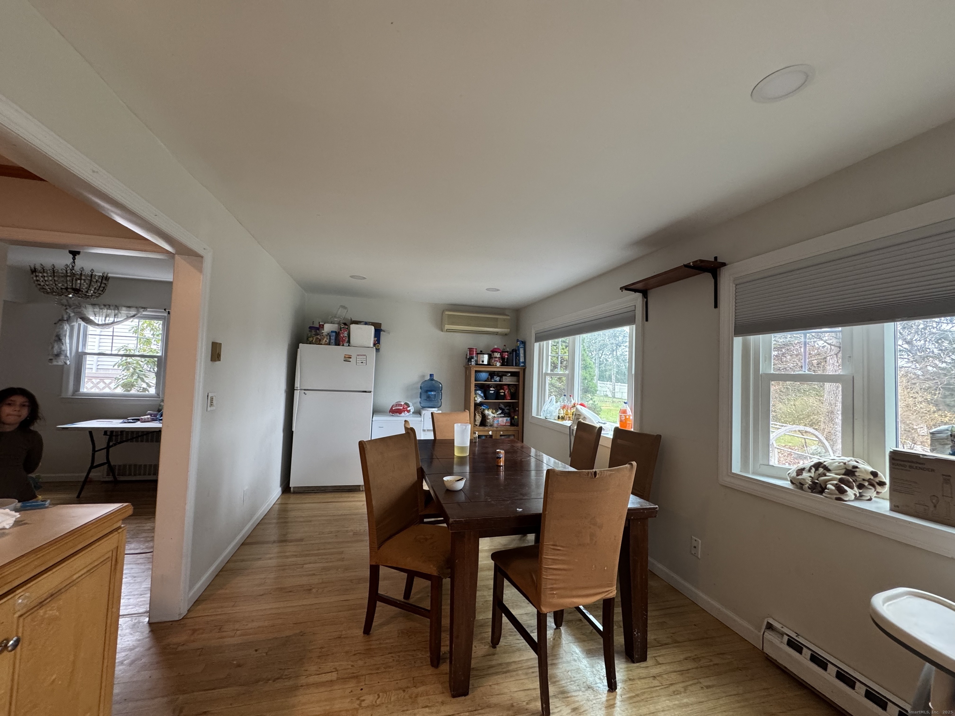 20 Oak Ridge Gate Danbury, CT 06810 - Photo 7 of 15 a view of a dining room with furniture and wooden floor