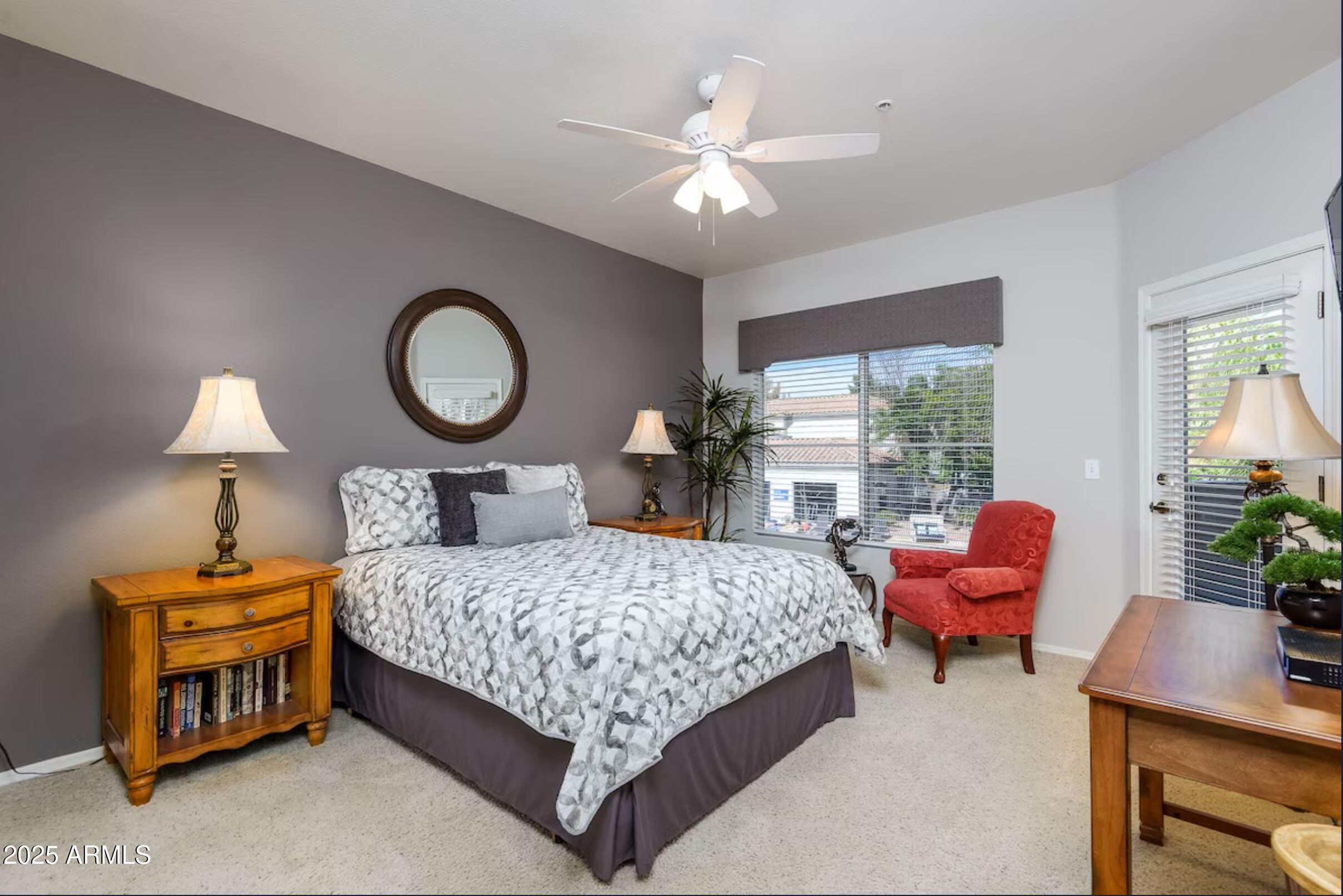 600 West Grove Parkway Tempe, AZ 85283 - Photo 14 of 23 a bedroom with a bed and a chandelier
