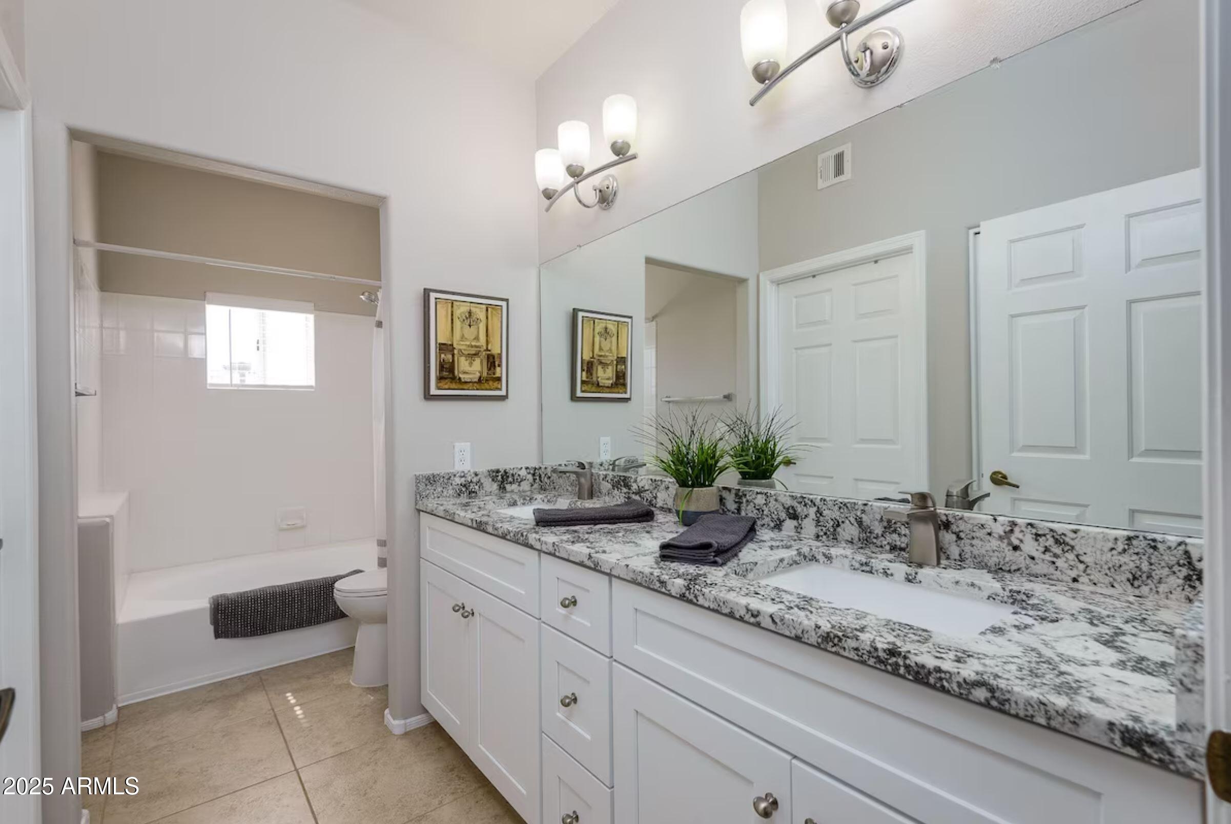 600 West Grove Parkway Tempe, AZ 85283 - Photo 16 of 23 a bathroom with a sink and a mirror