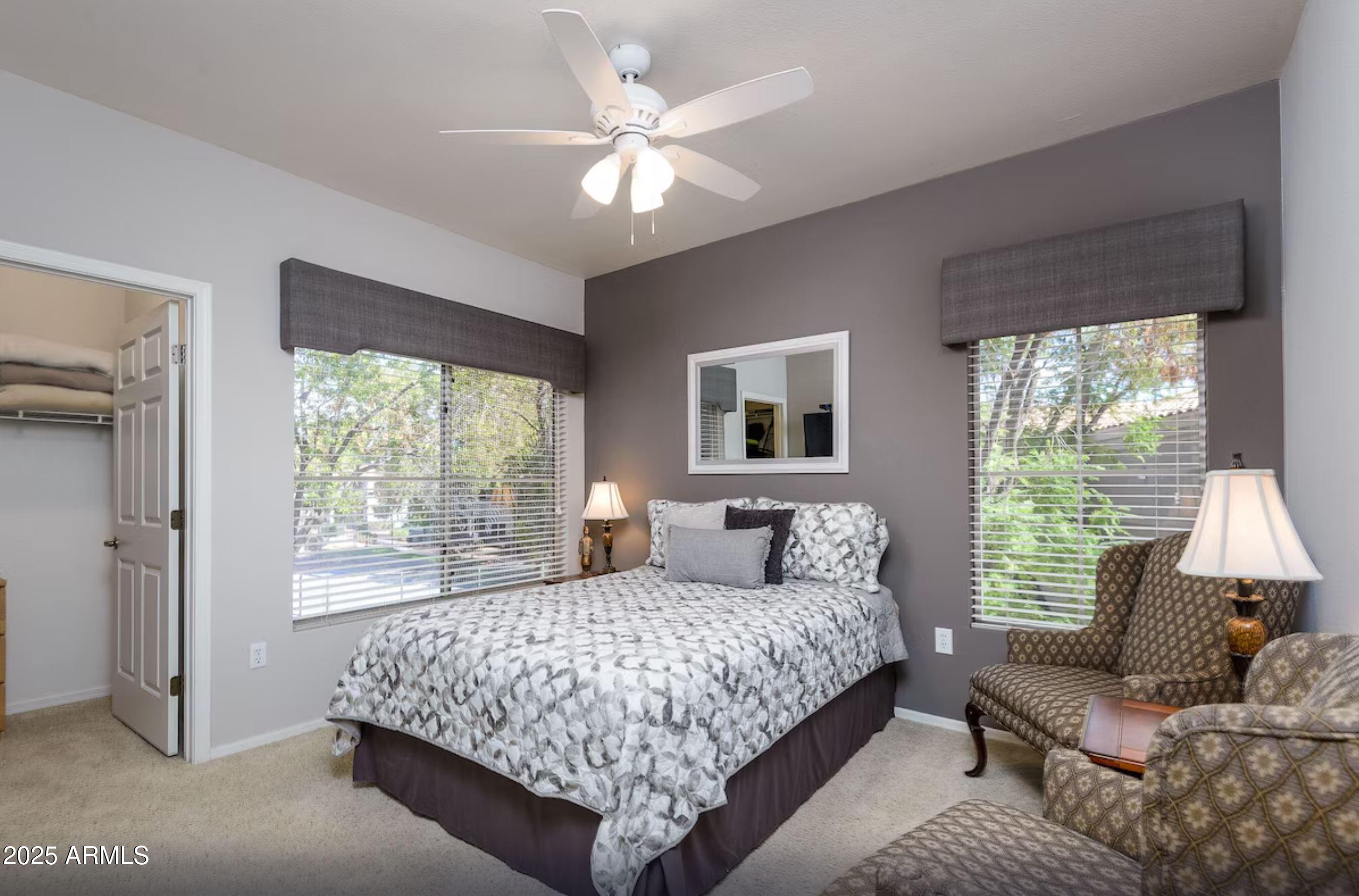 600 West Grove Parkway Tempe, AZ 85283 - Photo 4 of 23 a bedroom with a large bed couch and a window