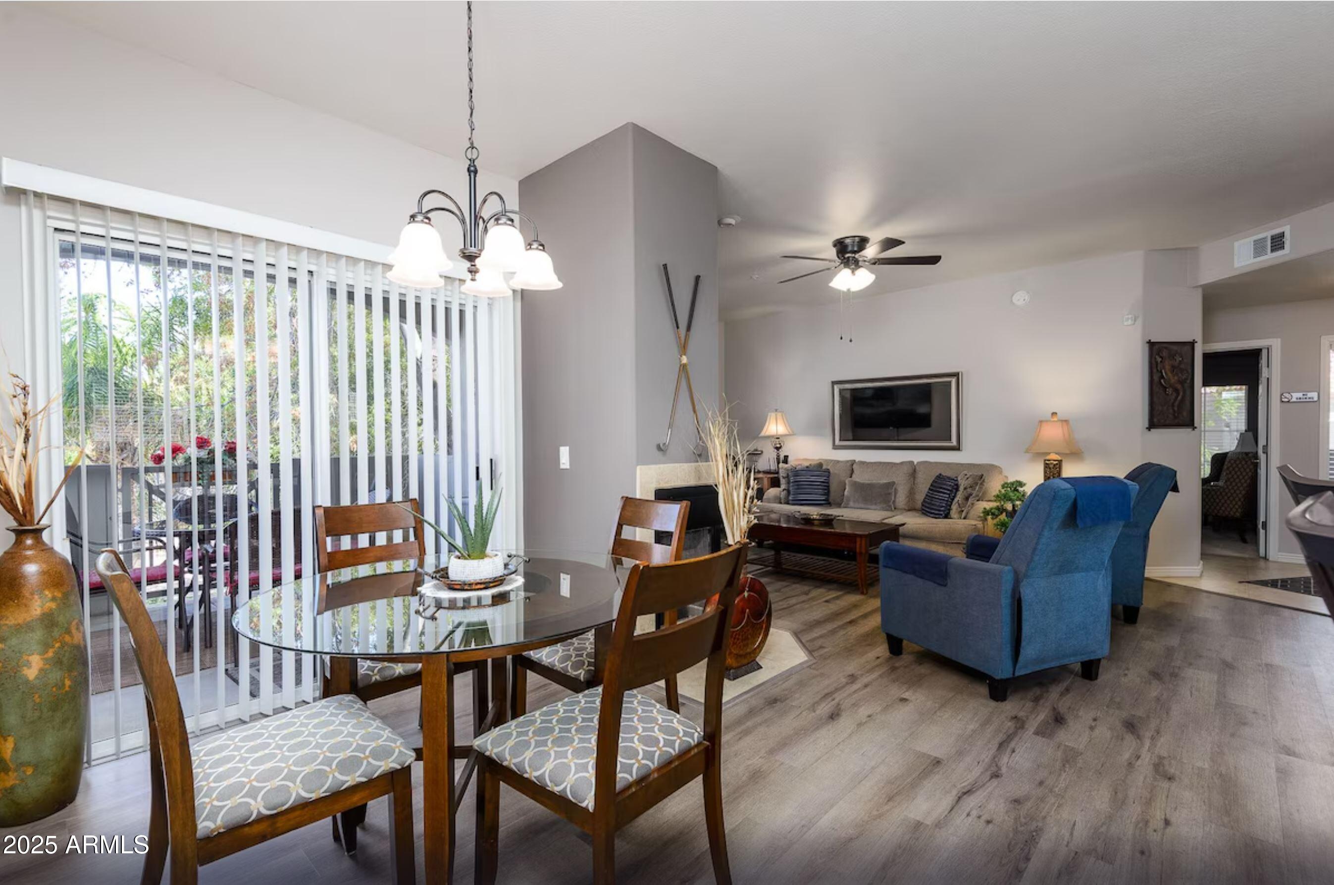 600 West Grove Parkway Tempe, AZ 85283 - Photo 22 of 23 a living room with furniture and a flat screen tv
