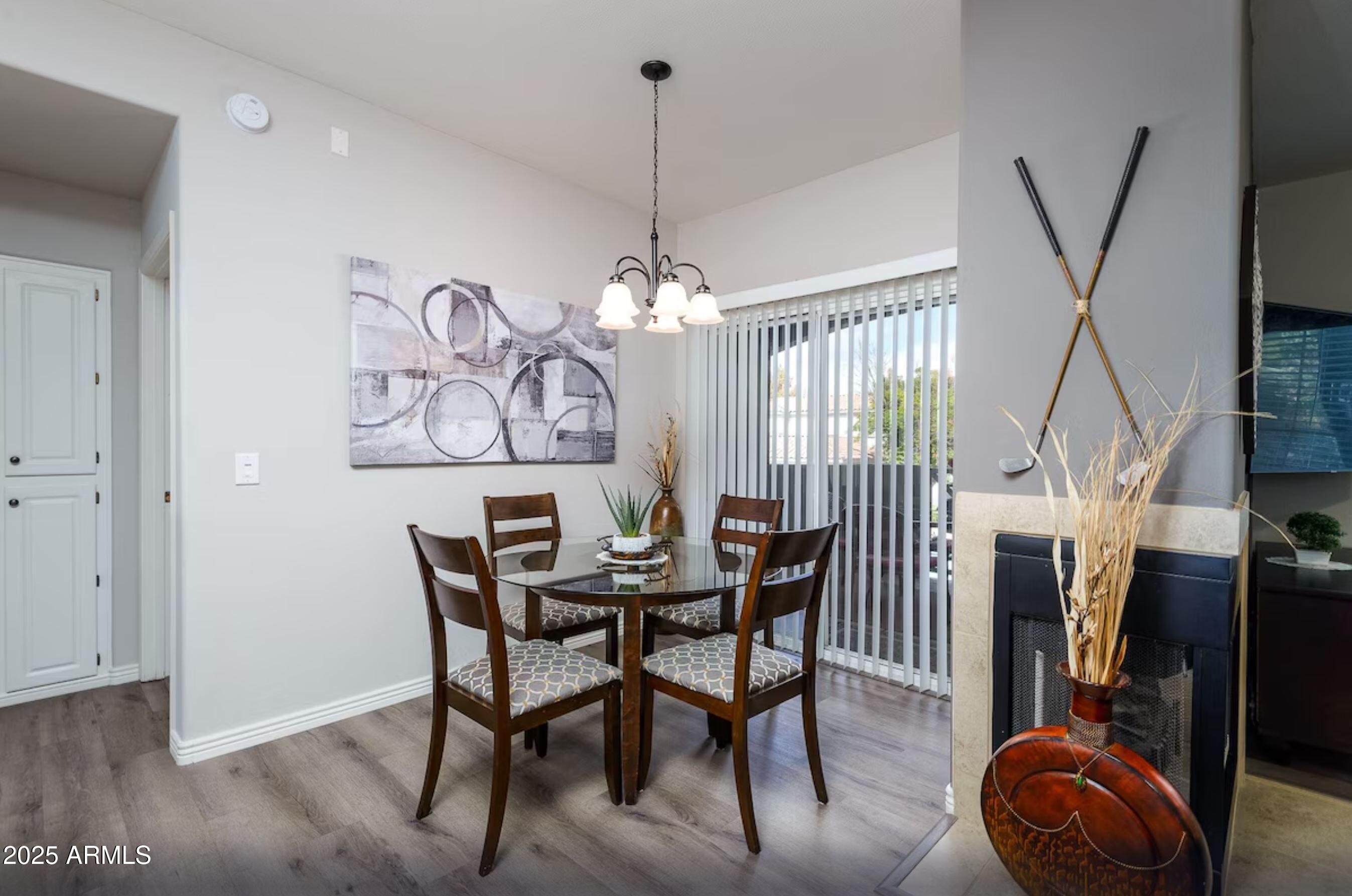 600 West Grove Parkway Tempe, AZ 85283 - Photo 7 of 23 a view of a dining room with furniture window and wooden floor