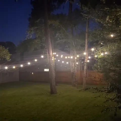 a bedroom with a bed and a wall painting