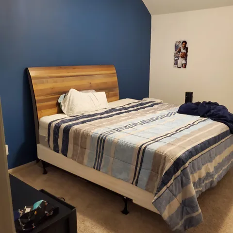 a room with wooden floor table tennis table and a window