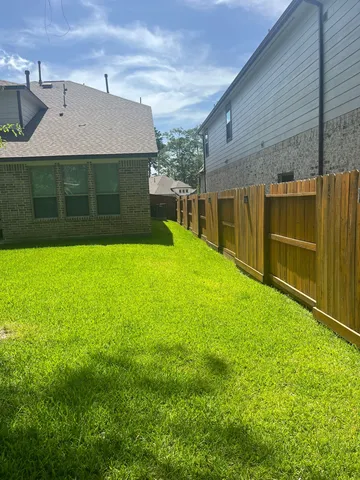 a view of yard with patio