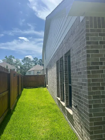 a view of yard with patio