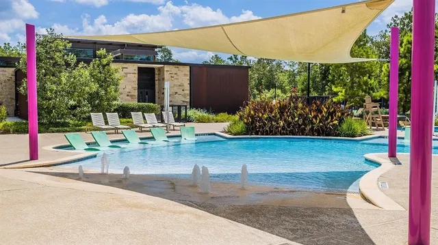 a view of a patio with table and chairs and potted plants